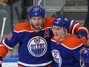 Edmonton Oilers Leon Draisaitl (left) celebrates a goal with team mate Tyson Barrie (right) during National Hockey League game action against the Pittsburgh Penguins in Edmonton on Monday October 24, 2022. The Oilers defeated the Penguins 6-3.