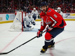 Washington Capitals captain Alex Ovechkin goes after a puck in the corner at Capital One Arena on Saturday night. The Maple Leafs kept Ovechkin off the scoresheet and away from Gordie Howe's goal mark for at least another night.