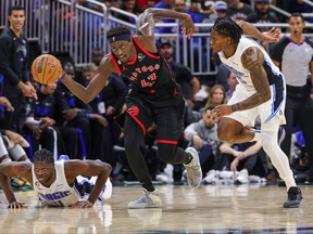 Raptors forward Pascal Siakam (43) brings the ball up court against Orlando Magic forward Admiral Schofield on Friday night.