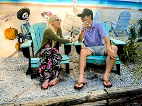 A young couple enjoys lunch on Main St., Dunedin. Veronica Henri photo