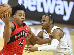 Toronto Raptors forward Scottie Barnes (4) drives against Cleveland Cavaliers forward Isaac Okoro (35) in the first quarter at Rocket Mortgage FieldHouse.