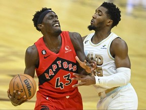 Toronto Raptors forward Pascal Siakam (left) deals with defence from Cleveland Cavaliers guard Donovan Mitchell on Dec. 23, 2022 at Rocket Mortgage FieldHouse in Cleveland.