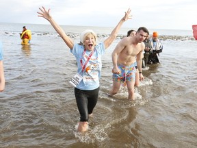 The 2020 Courage Polar Bear Dip for World Vision Canada clean water projects celebrated its 35 anniversary in Oakville as hundreds plunged into Lake Ontario at Bronte Beach Park. (Pictured) Gaye "Momma Bear" Courage comes out of the water.