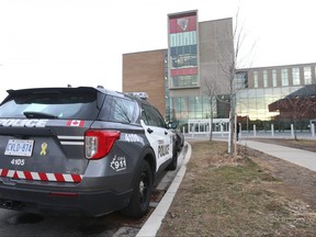 A Toronto Police vehicle outside David and Mary Thomson Collegiate Institute on Brockley Dr. in Toronto on Friday, December 2, 2022.