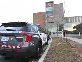 A Toronto Police vehicle outside David and Mary Thomson Collegiate Institute on Brockley Dr. in Toronto, Dec. 2, 2022.