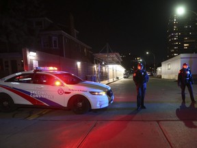 Toronto Police, paramedics and TTC security staff at High Park TTC station on Thursday, December 8, 2022 after cops say a stranger attacked two women on a train. One of them was killed.