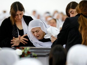 An Israeli Druze woman reacts in front of the body of 17-year-old Tiran Fero, on November 24, 2022, during his funeral ceremony in Daliyat al Karmel.