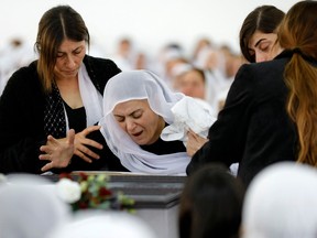 Israel indicts soldiers for attempting to bomb Palestinian home 2 An Israeli Druze woman reacts to the body of 17-year-old Tiran Fero on November 24, 2022, during his funeral ceremony in Daliyat al-Karmel.
