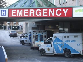 Toronto EMS vehicles sit in the emergency entrance at East York's Michael Garron Hospital, Jan. 10, 2022.