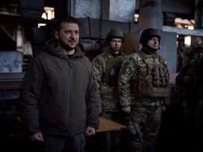 Ukraine's President Volodymyr Zelenskyy visits Ukrainian service members at their position in the frontline town of Bakhmut, amid Russia's attack on Ukraine, in Donetsk region, Ukraine Dec. 20, 2022.