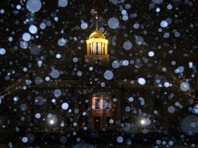 Snow falls during a winter storm warning at the Old Capitol Building in Iowa City, Iowa, Dec. 21, 2022.