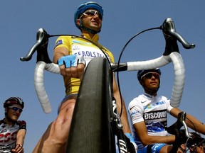In this file photo taken on March 16, 2007, Italian Davide Rebellin (Gerolsteiner/Ger) waits for the start of the fifth stage of the 65th edition of the Paris/Nice cycling race between Sorgues and Manosque.