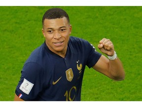 France's forward Kylian Mbappe celebrates scoring his team's third goal during the Qatar 2022 World Cup round of 16 football match between France and Poland at the Al-Thumama Stadium in Doha on December 4, 2022.