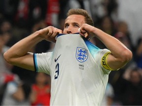 England forward Harry Kane reacts after missing a penalty kick during the France vs Qatar 2022 World Cup quarter-final at Al-Bayt Stadium in Al Khor on December 10, 2022.
