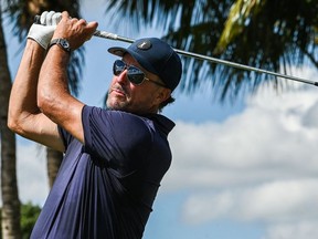 In this file photo taken on October 28, 2022, US golfer Phil Mickelson plays a shot during the first round of the 2022 LIV Golf Invitational Miami at Trump National Doral Miami golf club in Miami, Florida.
