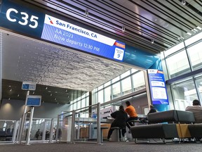 The new High C gates at Dallas Fort Worth International feature massive digital signs so that passengers can see their flight’s status from across the terminal. Chris Bousselot/DFW Airport