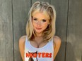 Young pretty blonde in Hooters tank top.