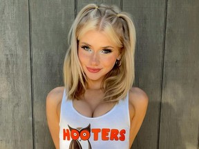 Young pretty blonde in Hooters tank top.