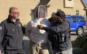 A protester wearing a beekeeper suit was accused of setting honeybees free to attack Massachusetts sheriff’s deputies during a home repossession protest. HAMPDEN COUNTY SHERIFF’S DEPARTMENT HANDOUT