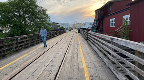 A trolley line passes by warehouses, shops and restaurants along Astoria’s waterfront. (Alex Pulaski for The Washington Post)