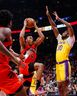 Raptors' Scottie Barnes drives to the net against Los Angeles Lakers' Damian Jones during the first half at Scotiabank Arena on Wednesday, Dec. 7, 2022 in Toronto.