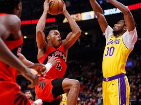 Raptors' Scottie Barnes drives to the net against Los Angeles Lakers' Damian Jones during the first half at Scotiabank Arena on Wednesday, Dec. 7, 2022 in Toronto.