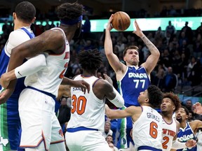 Dallas Mavericks guard Luka Doncic scores near the end of the fourth quarter against the New York Knicks at American Airlines Center.