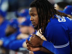Toronto Blue Jays first baseman Vladimir Guerrero Jr. (27) looks on from the dugout as they face the Seattle Mariners during ninth inning American League wild card MLB postseason baseball action in Toronto on Saturday, October 8, 2022. Guerrero Jr., had a .274 batting average, smashed 32 home runs, and won a Gold Glove for his fielding.