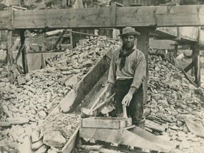 Miner Bill Phinney works a "hand rocker" on the Caledonia Claim at Williams Creek during the Cariboo Gold Rush in the British Columbia interior in the 1860s.