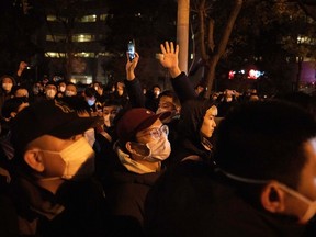 Protesters march in Beijing on Nov. 27, 2022. China's tough zero-COVID lockdowns have been linked to a rare wave of protests across the country in recent weeks — but immigration industry experts say the pandemic rules are also fuelling a surge in immigration to Canada.