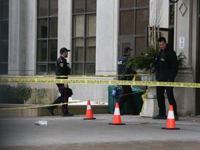 York Regional Police forensics crews work outside the condo building in Vaughan on Monday, Dec. 19, 2022, where six people were shot dead on Sunday night. Police shot and killed the gunman identified by police as Francesco Villi, 73, who lived at the condo.