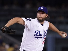 Los Angeles Dodgers starting pitcher Clayton Kershaw throws to the plate during the first inning of a baseball game against the Colorado Rockies Friday, Sept. 30, 2022, in Los Angeles.