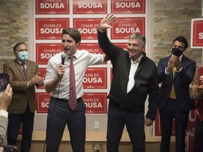Prime Minster Justin Trudeau delivers remarks next to Charles Sousa at his campaign office, during a byelection campaign stop in Mississauga, Ont., Dec 1, 2022.