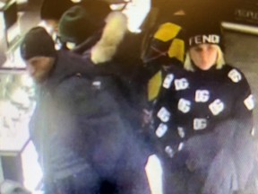 Image released by Toronto Police of suspects in a Boxing Day theft at Scarborough Town Centre.