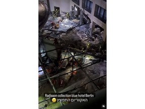 Following the burst of a huge aquarium, the atrium of a hotel is devastated in Berlin, Dec. 16, 2022.