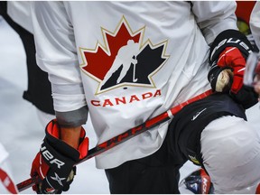 A Hockey Canada logo is shown on the jersey of a player with Canada's National Junior Team during a training camp practice in Calgary, Tuesday, Aug. 2, 2022.