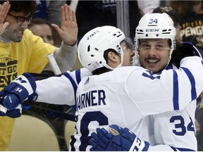 Toronto Maple Leafs right wing Mitchell Marner celebrates his goal with center Auston Matthews against the Pittsburgh Penguins during the first period at PPG Paints Arena.