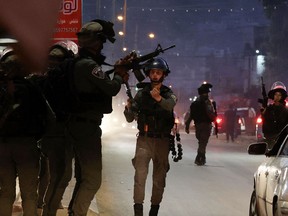 Israeli security forces deploy in the occupied West Bank city of Hawara, following an incident during which a Palestinian man was reportedly shot dead by Israeli police, on December 2, 2022.