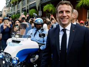 French President Emmanuel Macron walks through the historic French Quarter in New Orleans, Louisiana on December 2, 2022.