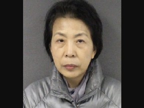Mugshot of older Asian woman.