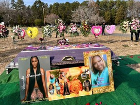 Photos displayed during Shanquella Robinson's funeral on Nov. 19, 2022, in Charlotte, N.C.. Robinson died in late October in Mexico.