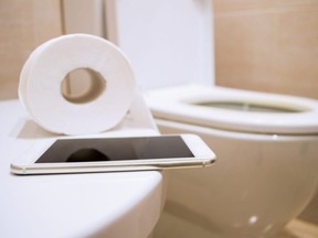 Experts says scrolling on your electronic device while sitting on the toilet for long periods of time is not healthy.