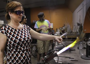Tourists learn how glass melts and can be shaped into art at Zen Glass Studio and Gallery. A beginner’s project starts with forming a stem for a wine glass. Veronica Henri photo