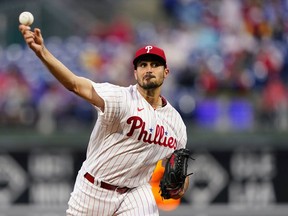 FILE - Philadelphia Phillies' Zach Eflin pitches during the first inning of the team's baseball game against the Colorado Rockies, April 26, 2022, in Philadelphia. Eflin has agreed to join the Tampa Bay Rays on a three-year, $40 million contract that's the largest the club has ever awarded in free agency, a person familiar with the deal told The Associated Press.