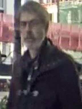 Investigators need help identifying this man who is suspected of robbing a woman at an ATM machine near Bloor and Bathurst Sts. on Oct. 16, 2022.