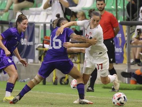 Canada's Jessie Fleming, right is challenged by Argentina's Marina Delgado during a women's international friendly soccer match between Canada and Argentina in Sanlucar de Barrameda, Spain, Thursday, Oct. 6, 2022. Fleming has been named Canada Soccer's player of the year for the second year in a row.