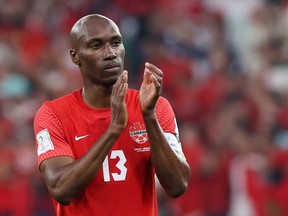 Canada's Atiba Hutchinson applauds fans after a 2-1 loss to Morocco at the Al Thumama Stadium in Doha, Qatar on Dec. 1, 2022.