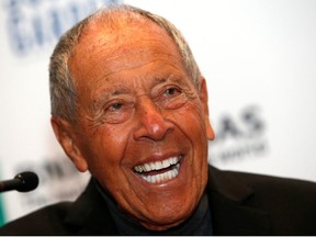 Tennis coach Nick Bollettieri laughs during a news conference where he was introduced as one of the five new inductees to the International Tennis Hall of Fame in New York, March 3, 2014.