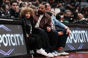 Drake and his son Adonis at the Toronto Raptors game on Dec. 7.