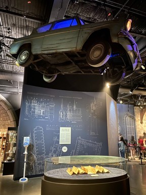 One of the flying cars created for Harry Potter and the Chamber of Secrets hangs over the Marauder’s Map from Prisoner of Azkaban. CYNTHIA MCLEOD/TORONTO SUN